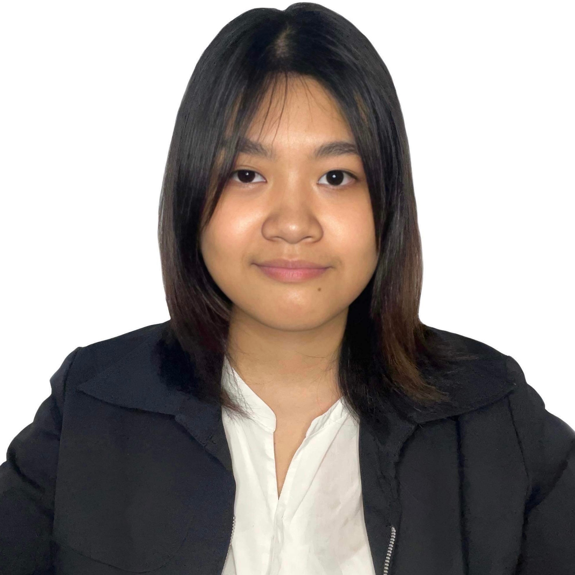 Franzene, a professional member of the Altselino support team, wearing a black blazer and white blouse against a clean white background.
