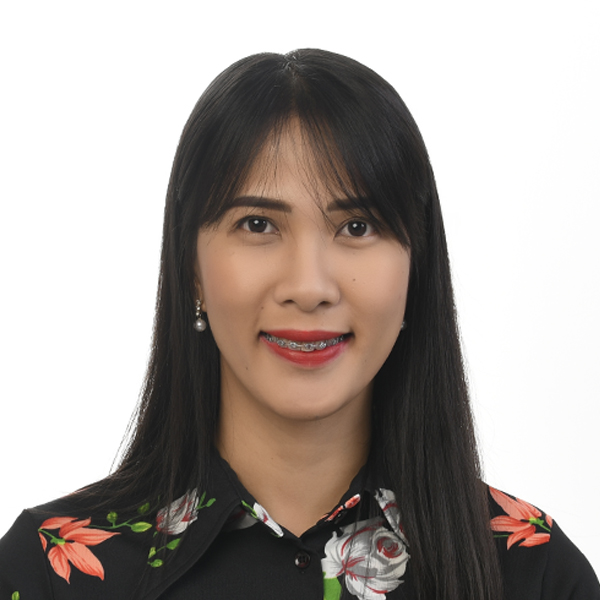 Jasmin, the Operations and Admin Lead at Altselino, wearing a floral black shirt against a white background.