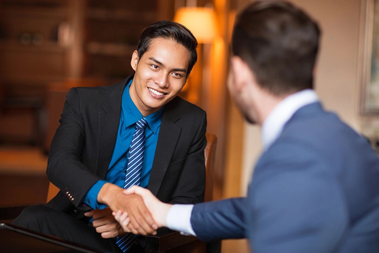 Business professionals discussing IT solutions and technology consulting services.